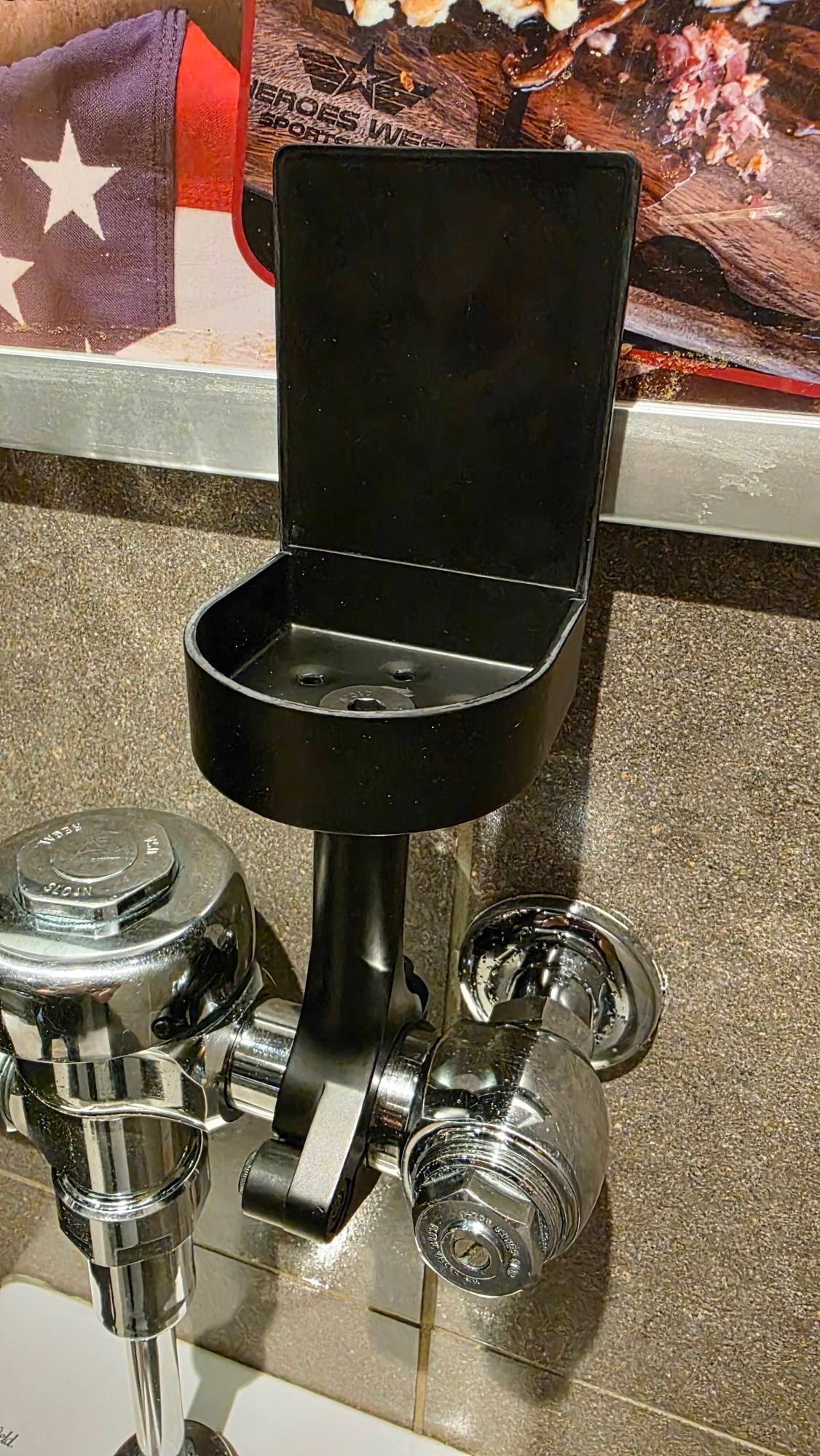 DrinkTight secured to a urinal flush valve